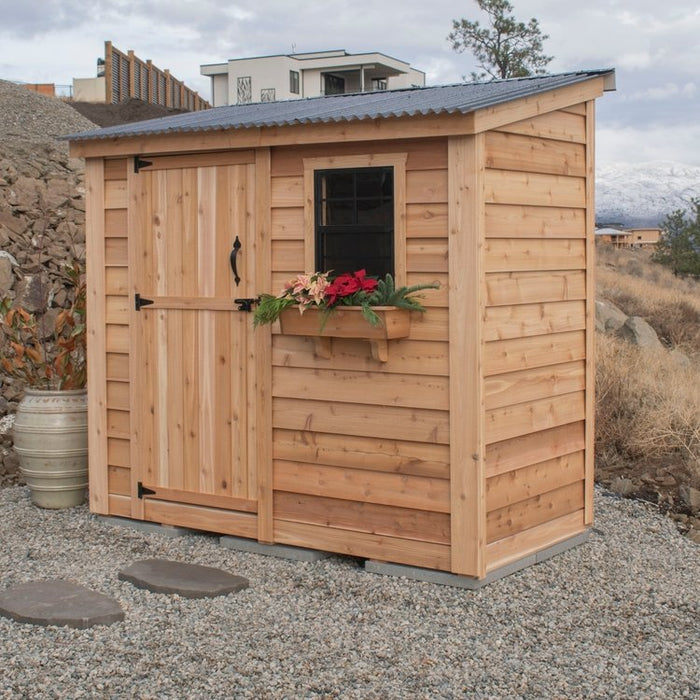 Close-up of the single door detail on the SpaceSaver 8x4 cedar storage shed, showing wood grain and hardware.