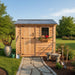 Cedar storage shed with a single door shown from a side angle, highlighting the SpaceSaver 8x4's compact outdoor design.