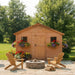 Detail view of the cedar Sunshed 12x12 garden shed, highlighting its wood construction and window trim.
