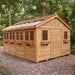 Detail view of the cedar Sunshed 12x16 garden shed, highlighting its wood siding and window trim craftsmanship.