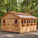 Detail view of the cedar Sunshed Garden Shed 12x16, showing wood paneling, window trim, and roofline construction.