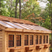 Detail view of the cedar Sunshed Garden Shed 12x16, showcasing its wood grain texture and sturdy panel construction.