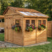 Close-up detail of the cedar Sunshed Garden Shed 8x8, showcasing natural wood grain and sturdy panel construction.