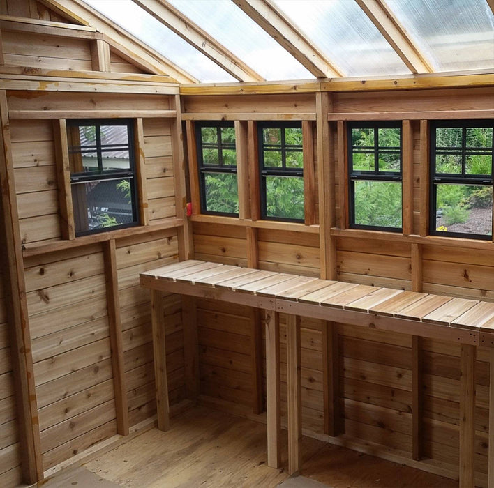 Close-up detail of the cedar Sunshed 8x8 garden shed, showing wood grain, joinery, and window trim craftsmanship.