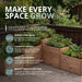 Cedar tiered raised garden bed in an L-shaped design, shown from a side angle to highlight its stepped planting levels.