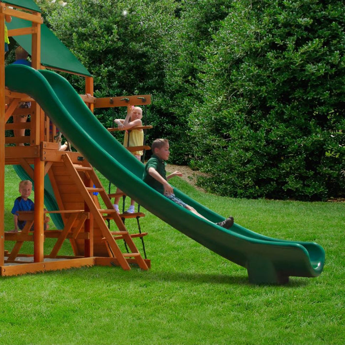 A kid sliding on the Great Skye I outdoor Swing Set