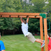 Child on the monkey bar of the Navigator Swing Set