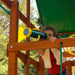 A girl playing the telescope of the outdoor kids playset