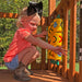 A child playing tictactoe on the  Swing set for kids