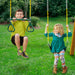 Children swinging on the outdoor playset