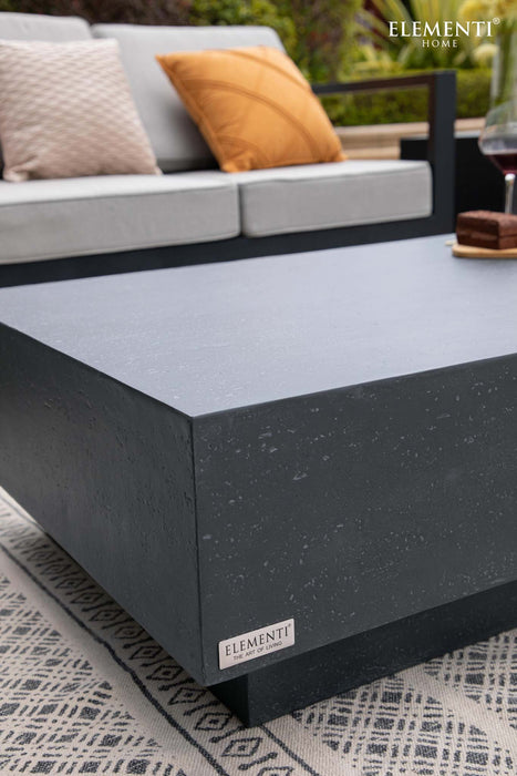 Close-up view of the Elementi Tevere Series Rectangle Large Coffee Table in Slate Black, highlighting the fine texture and brand label.