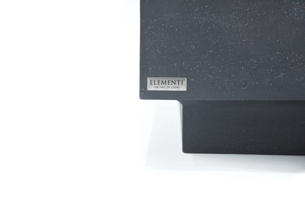 Close-up view of the Elementi brand label on the Tevere Series Coffee Table in Slate Black, showcasing its fine texture.