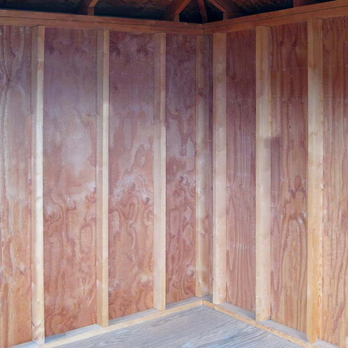 Interior view of the Little Cottage Co. Colonial Five-Corner Shed showing unfinished wooden walls and framing.