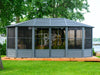 Image of the Freestanding Solarium Gazebo 12x18 with a slate metal roof installed in a backyard setting.