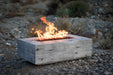 lit Rectangular Coronado Fire Pit Wood Grain GFRC Concrete - Ivory on the mountain, close up sige angle