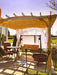 10x12 Pergola-In-A-Box outside a house with chairs and curtain