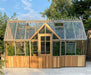 Decorative Alton Cedar Structure Cambridge Greenhouse showcasing its wooden frame and intricate glass panels.