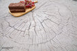 Close-up of the Elementi Daintree drift wood large coffee table with a cake and grape platter on its textured surface.