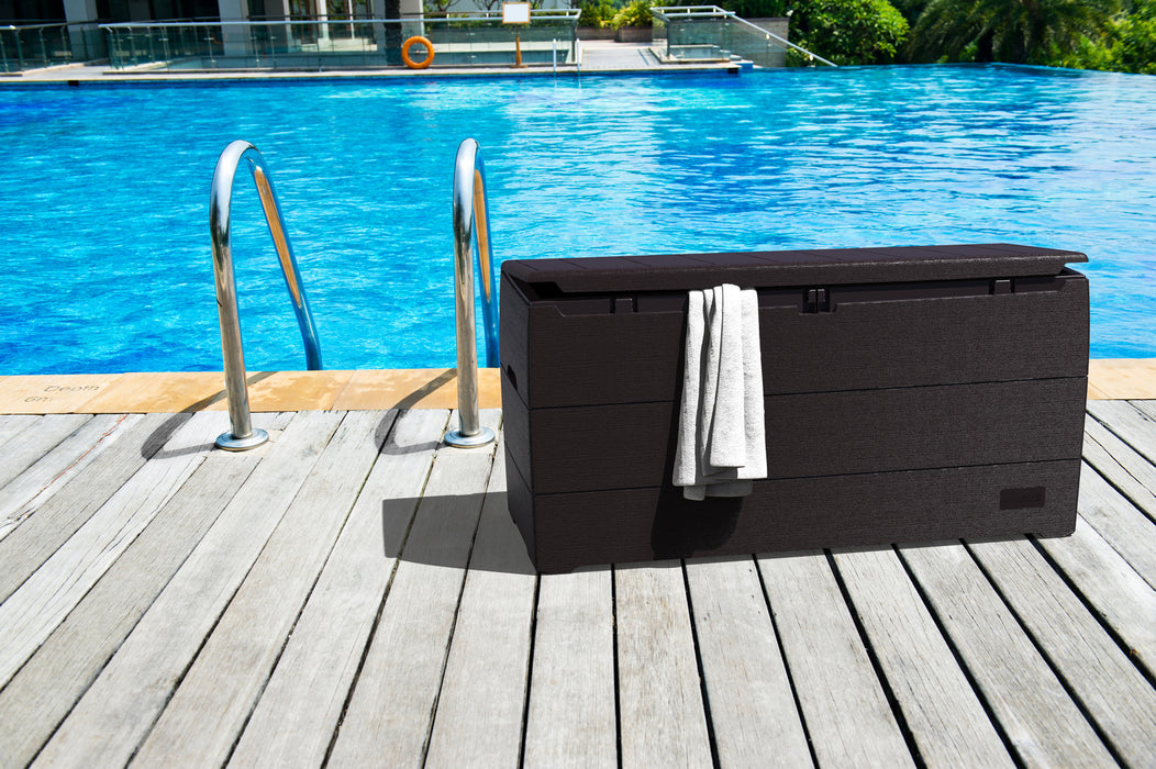 A 71 Gallon Duramax Storage Box in Brown, situated next to a swimming pool.