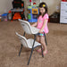 Child stacking Lifetime 13 Pack Children's Stack Chair showing lightweight design and molded handle for easy storage