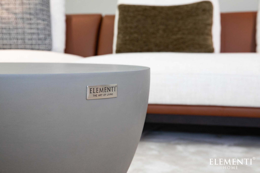 Close-up of the Elementi Chronos Series space grey coffee table, showcasing the product label and smooth finish.