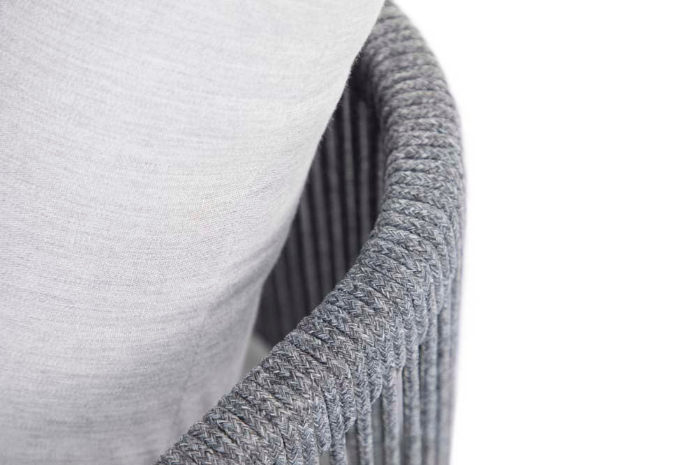 Detail view showing the elegant curve and woven gray rope texture on the backrest of the Capri Collection outdoor furniture chair by Elementi.