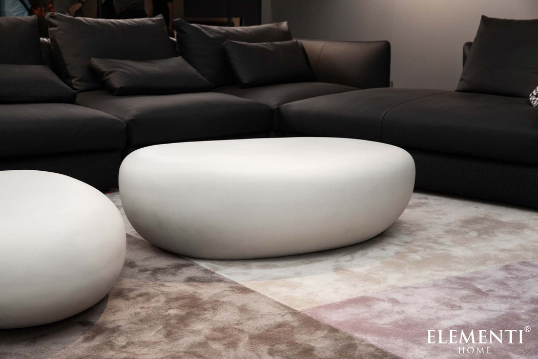 Close-up of the Elementi Hawaii Pebble Table in cream white, highlighting its smooth surface and contemporary style.