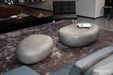 Close-up of Elementi Hawaii Pebble Table in Moon Grey setup in a stylish living room.