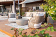 Stylish Malibu Collection lounge set by Elementi Outdoor Furnitures on a modern terrace, with curved chairs and neutral tones 