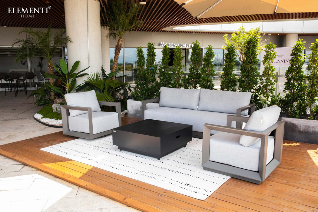 Elementi Outdoor Furnitures Newport Collection lounge set with a sofa, two armchairs, and a modern coffee table for patio relaxation.