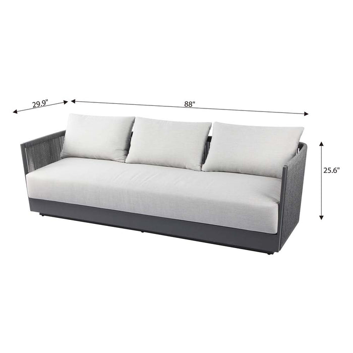 Dimension details of Elementi Capri Collection three-seater outdoor sofa with gray woven armrests and light fabric cushions, shown in frontal view.