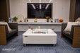 Ethanol fire table from Elementi Perth placed in a modern living room setting with flame on