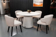 Elementi Rio Dining Table in cream white, styled in a modern dining room setting with white chairs.