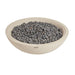 The Elementi Rose Bowl 48 Fire Pit in Frosted Cream White sits unlit on a plain white background, showing its wide round concrete basin filled with dark gray lava rock and a honed, softly textured finish from every angle.