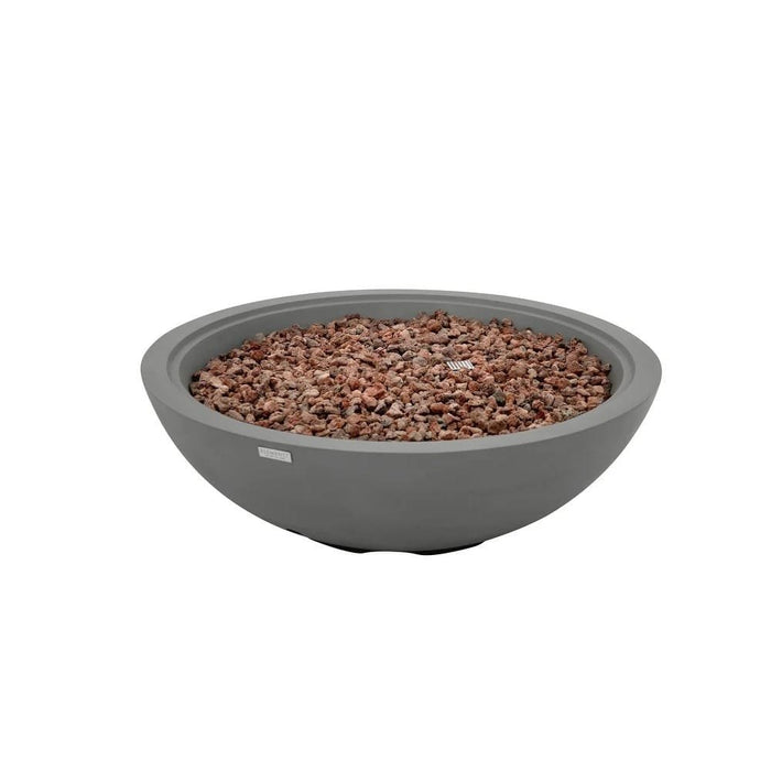 The Elementi Rose Bowl 48 Fire Pit in Moon Gray is photographed unlit on a plain white background, displaying its wide, shallow concrete basin filled with reddish-brown lava rock and a smooth, softly honed matte finish.