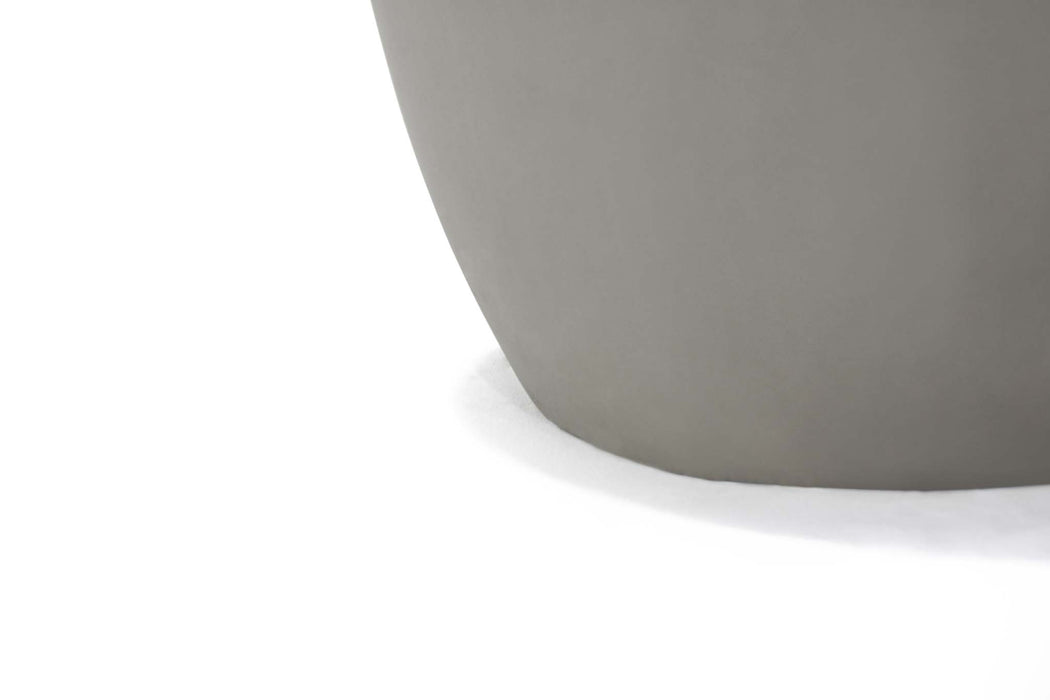 Closeup view of the bottom edge of the Elementi Space Grey Cobble Side Table.