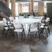 Lifetime 4 Pack 72in Round Table arranged with white folding chairs in modern indoor event space