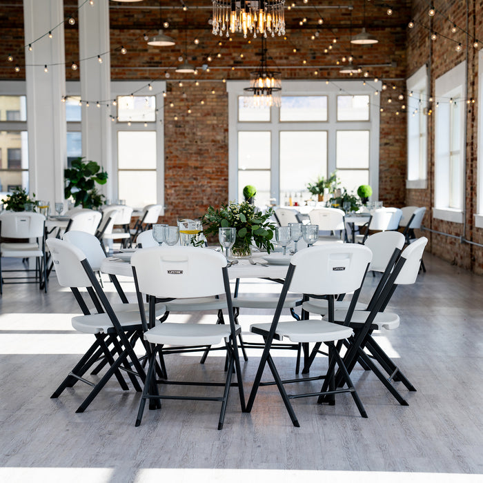 Elegant indoor venue setup featuring the Lifetime Commercial Folding Tables and Chairs Set with round tables and white chairs