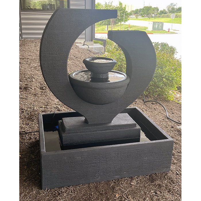 Large Exaco Eclipse Fountain in black, featuring a grand water feature with multiple tiers, ideal for an outdoor patio or garden space with sleek design and contemporary appeal.