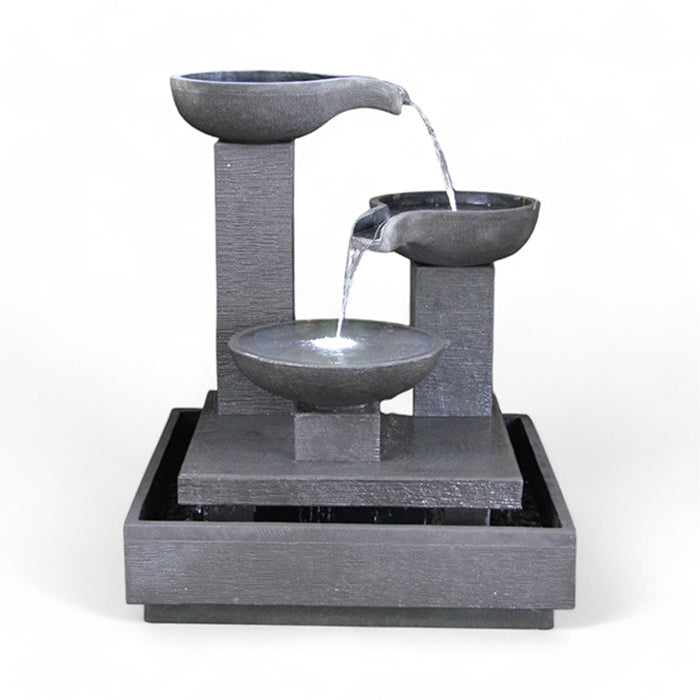 The Exaco Trio Bowl Fountain, featuring three cascading bowls in a dark grey finish, is a perfect addition to any garden or patio. Water flows elegantly from the top bowl to the bottom, creating a soothing sound.