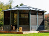 Image of the Freestanding Solarium gazebo with a slate polycarbonate roof installed in a backyard setting.