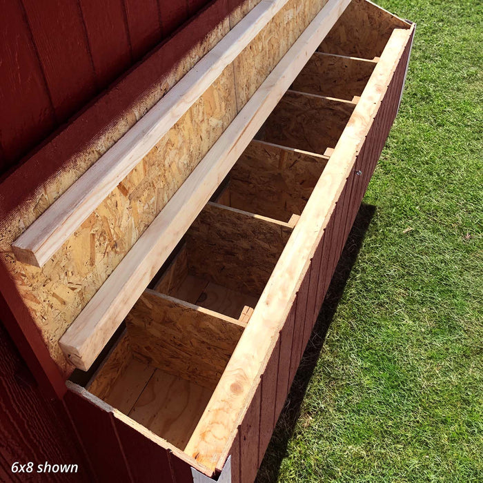 Exterior nesting boxes on the red Colonial Gable chicken coop by Little Cottage Co., lid open for easy access.