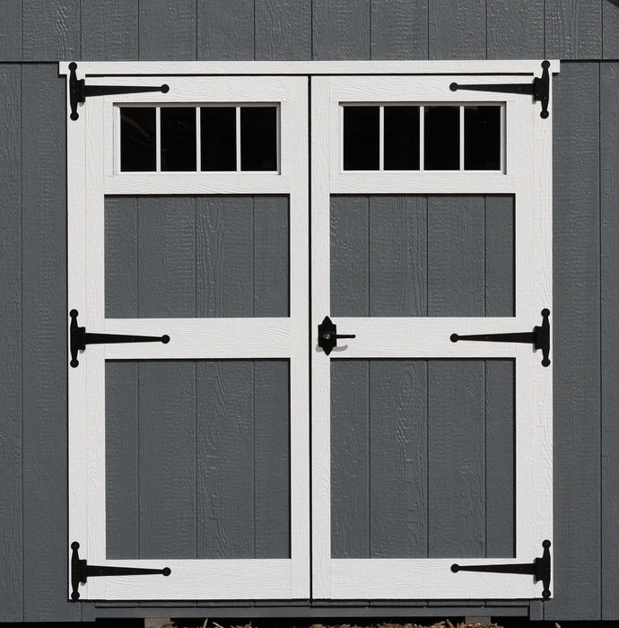 Skyview Shed Kit white double doors with transom windows, black T-hinges, and decorative latch against gray Ez-Fit Kits board-and-batten siding