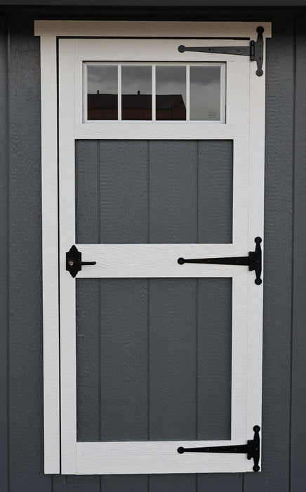 Ez-Fit Kits Skyview Shed Kit single door detail with white trim, transom window, black T-hinges, and gray board-and-batten siding