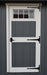 Ez-Fit Kits Skyview Shed Kit single door detail with white trim, transom window, black T-hinges, and gray board-and-batten siding