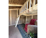 Interior of EZ-Fit Playhouse Kit featuring wooden loft, ladder access, open floor space and framed walls ready for finishing