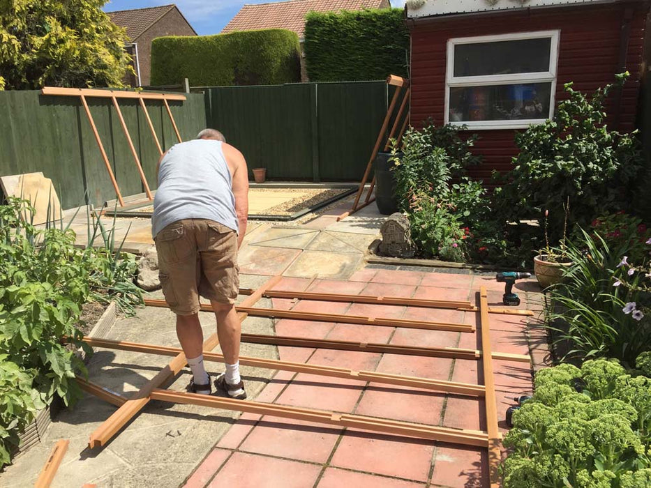 Frame assembly process of the Alton Cedar Structure Cheltenham Victorian Greenhouse.