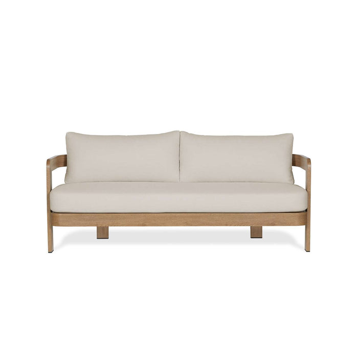Straight-on front view of the Real Flame Arlo Outdoor Seat Sofa with Cushions, featuring a minimalist design with natural wood and cream upholstery.