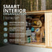Open double doors reveal the Grand Garden Chalet 6x3 interior with adjustable cedar shelves, hanging hooks and over 100 cu. ft. of tool storage.