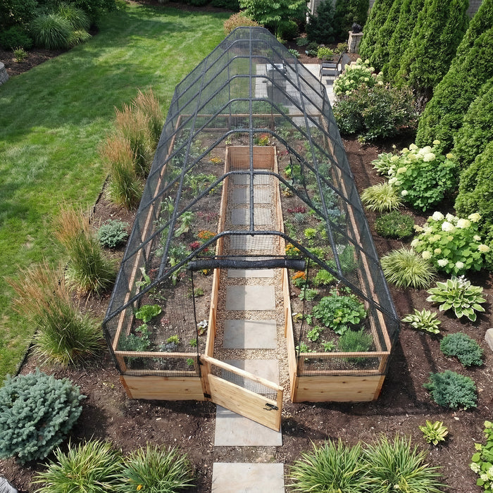 Aerial view of the Outdoor Living Today Garden in a Box with Birdnetting Cover 8x16, black mesh canopy over cedar beds and a paver walkway